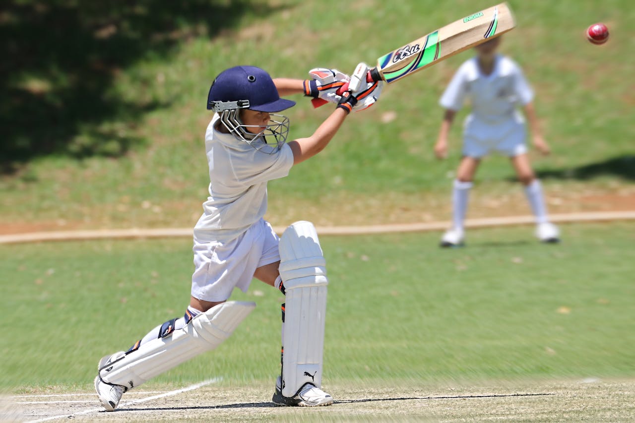 A boy on a cricket field