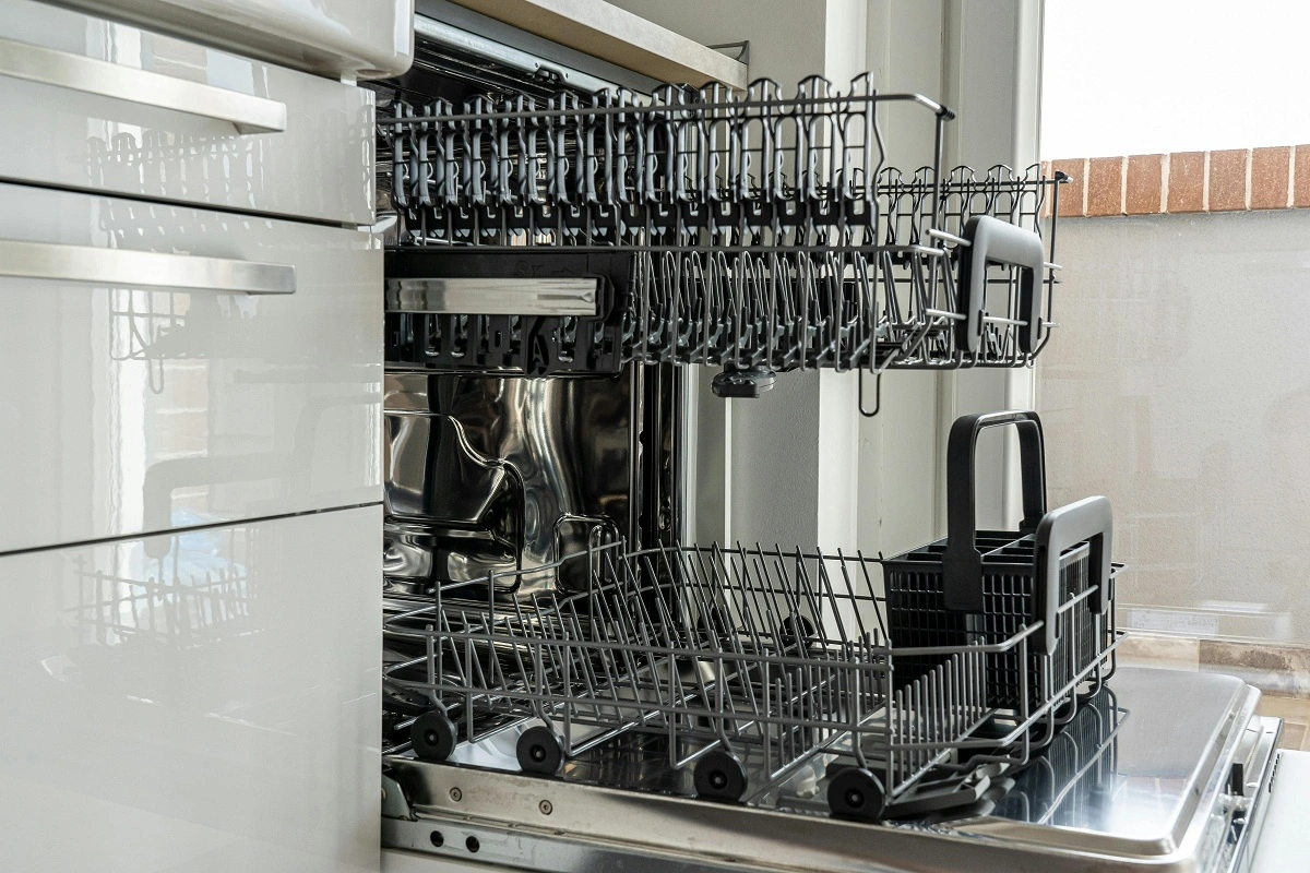 An empty open dishwasher