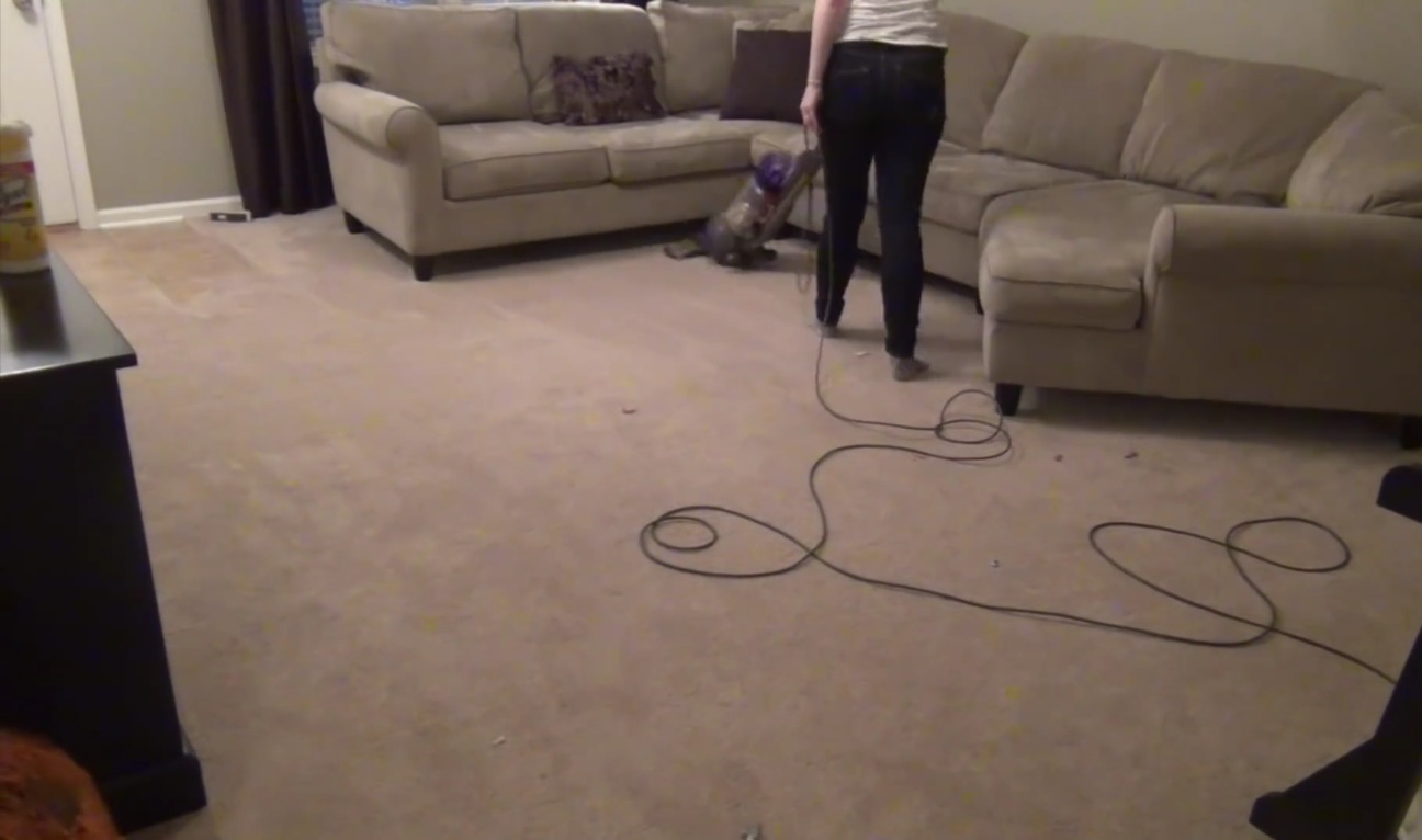 vacuum-cleaning-in-the-living-room-sw7 Living-room carpet treatment during a move-out clean-up in SW7, London