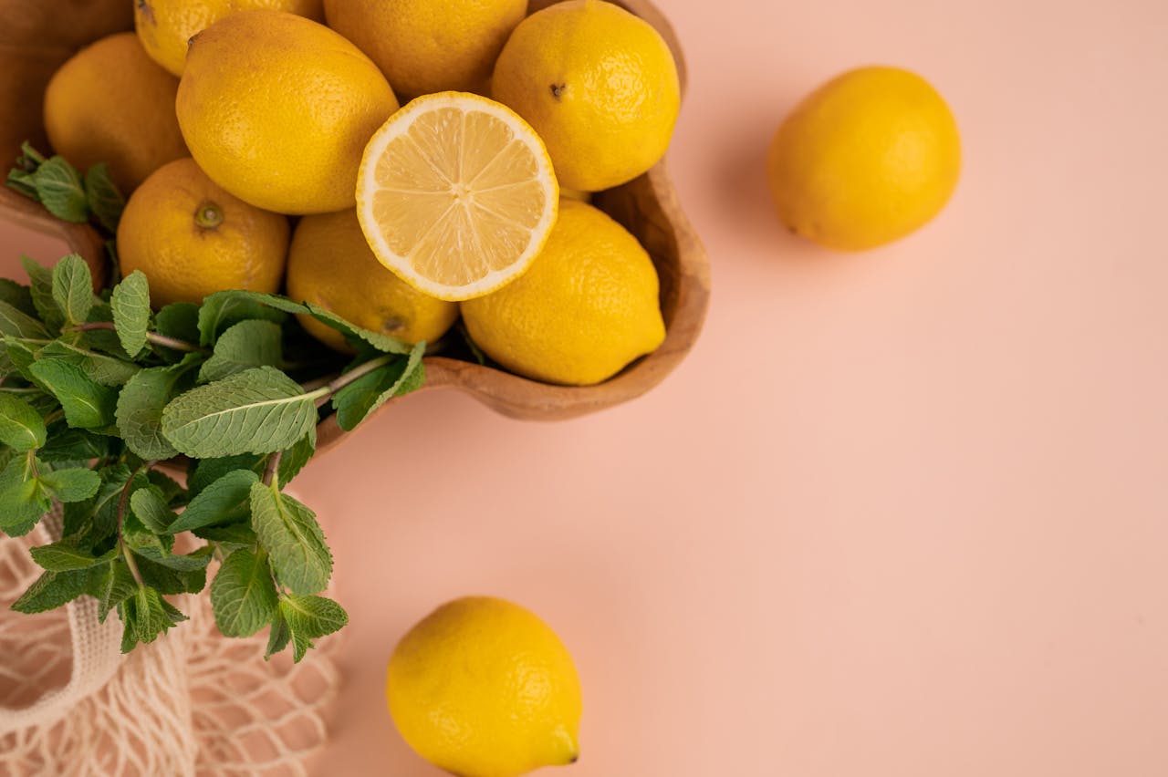 A few lemons and peppermint herbs on a table