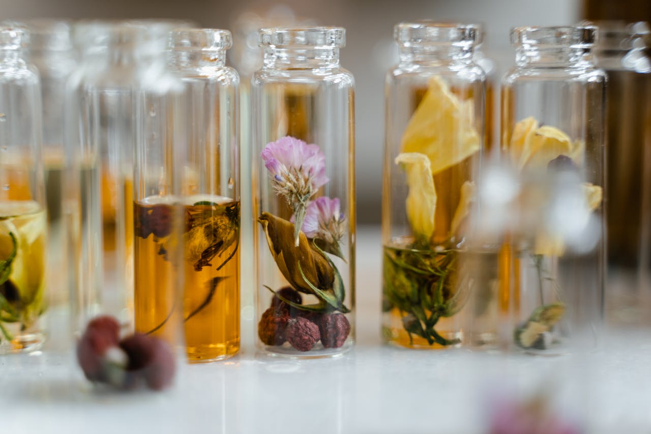 A close-up shot of small glass containers with essential oils