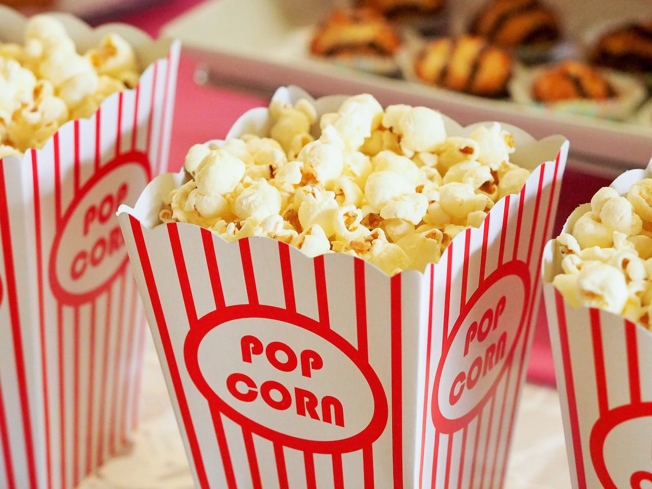 A paper cup of popcorn in a movie complex