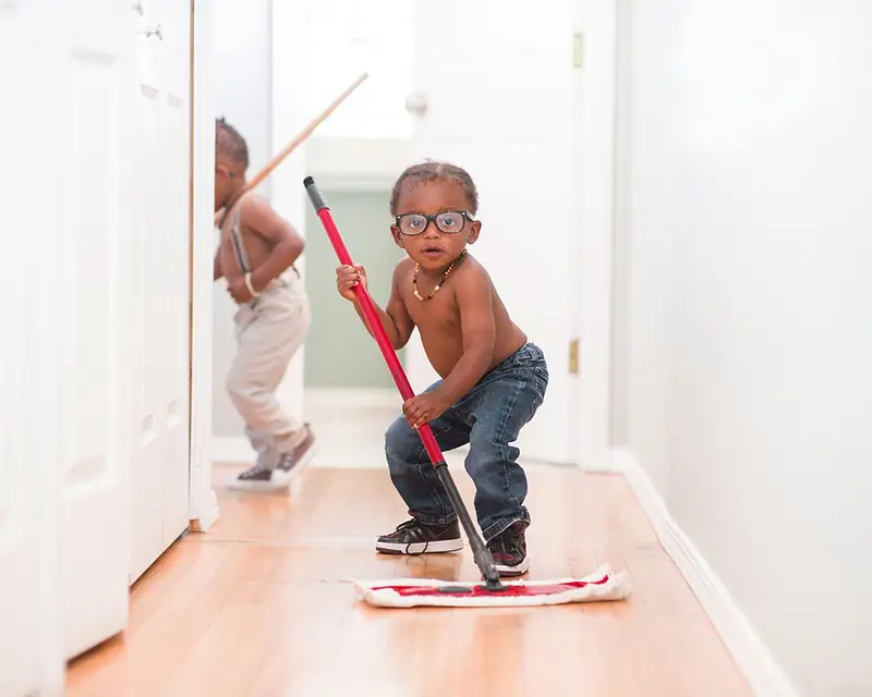 Kid Mopping the Floor