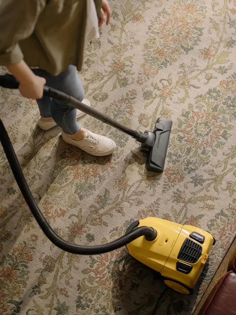 Woman Vacuuming Carpet