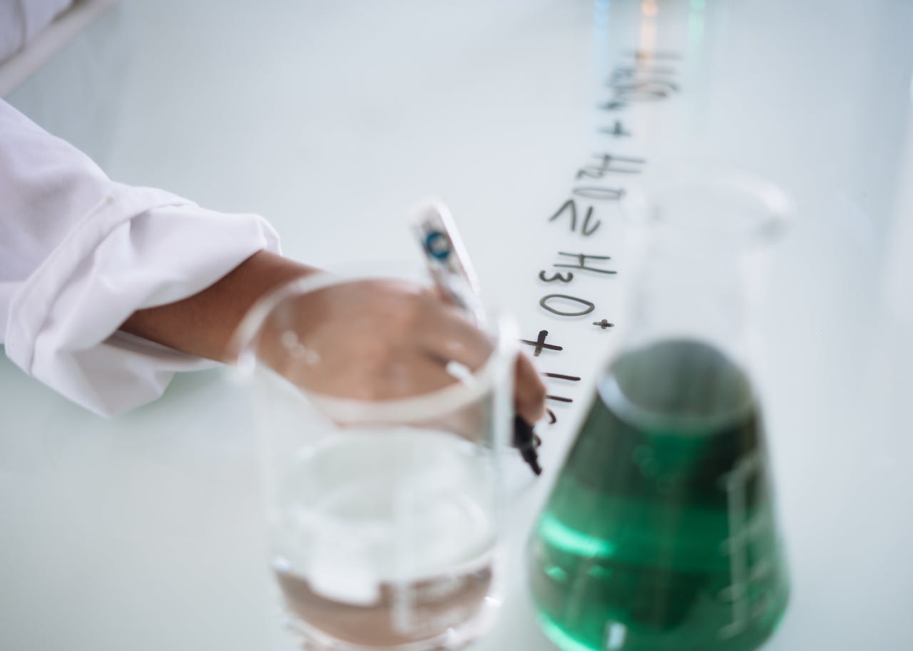 A chemical formula written on a white board in a laboratory