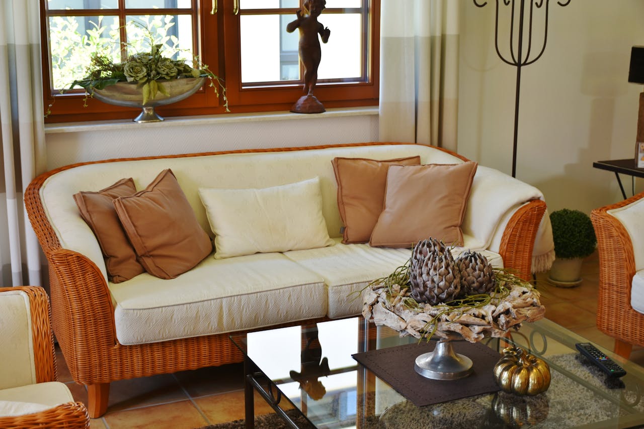An upholstered living room sofa with pillows
