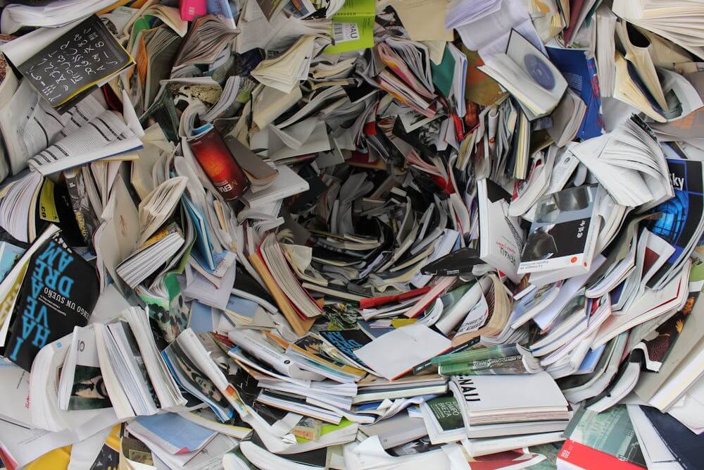 A hectic pile of old documents, papers, and newspapers
